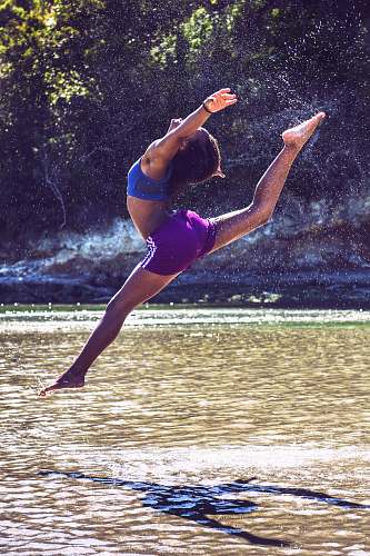 dance pose woman bending on body of water leisure activities